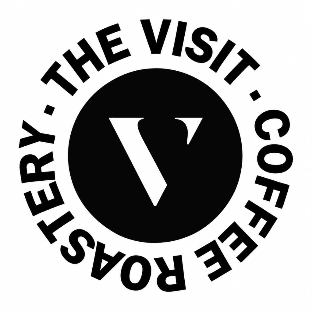 The Visit Coffee Roastery logo, a black circle with a white V